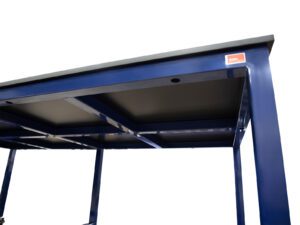 Underside detail showing the reinforced steel frame and phenolic worksurface support on an industrial workbench.