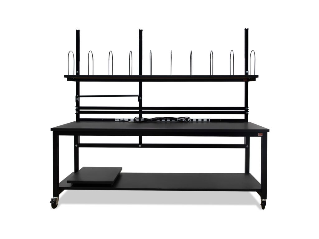 Mobile packing workbench with upper storage shelf, carton dividers, integrated power rail, and locking casters.